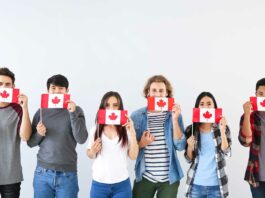 Trabajar en Canadá | Razones, requisitos y pasos para conseguirlo grupo-de-jóvenes-con-bandera-de-canadá